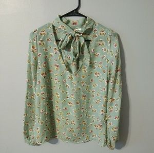 Mint Green floral long-sleeve blouse.